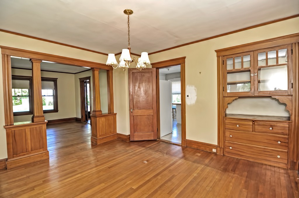 175 Union Street Walpole, MA 02032 - Photo 10 of 29 a view of a hallway with wooden floor and chandelier