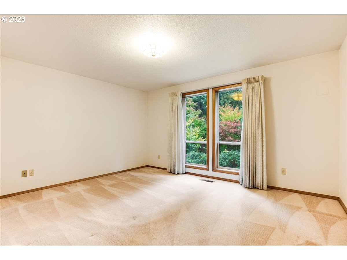 1502 Southeast Elliott Avenue Gresham, OR 97080 - Photo 20 of 37 a view of an empty room with a window