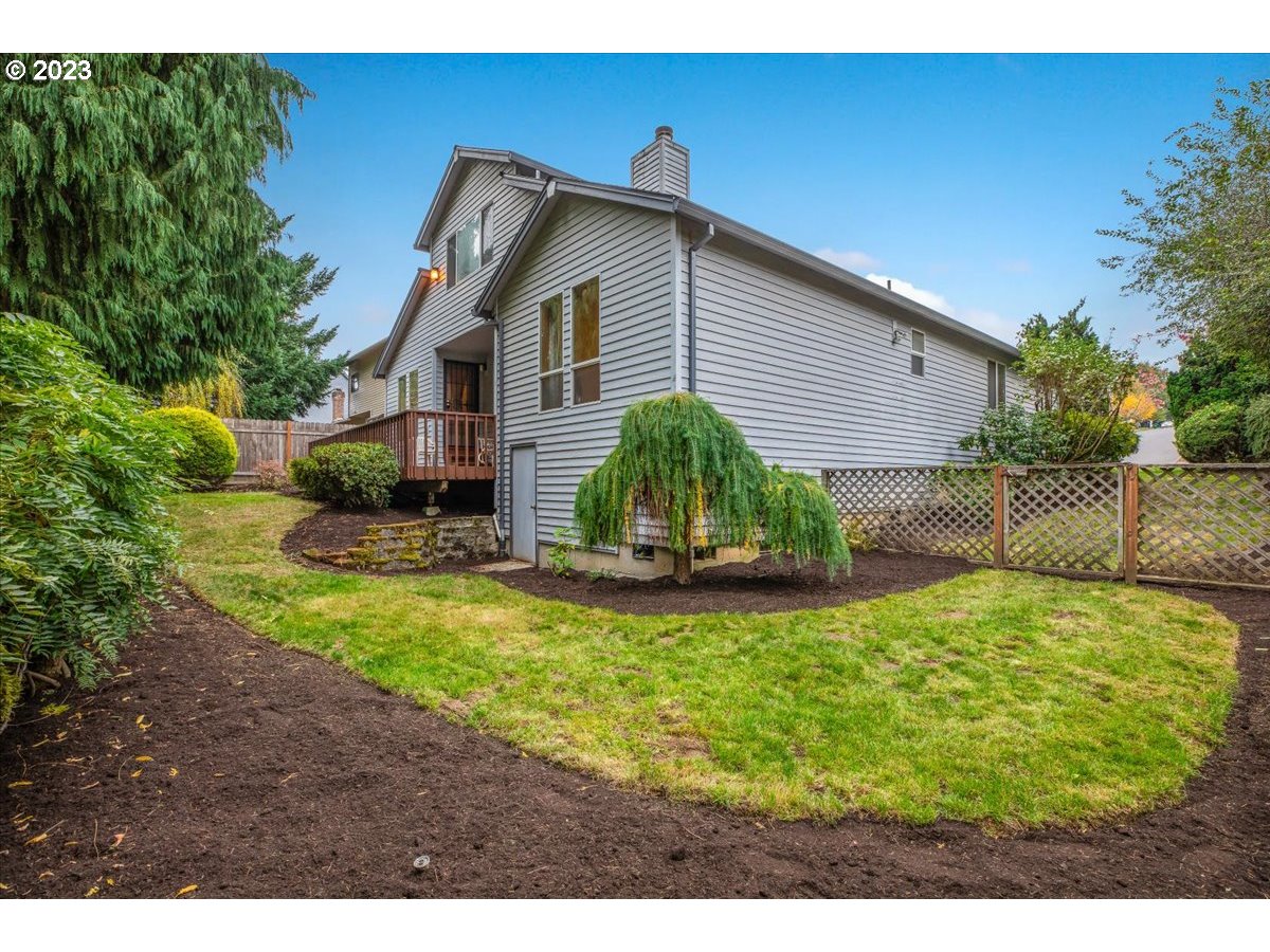 1502 Southeast Elliott Avenue Gresham, OR 97080 - Photo 32 of 37 a view of a house with a yard