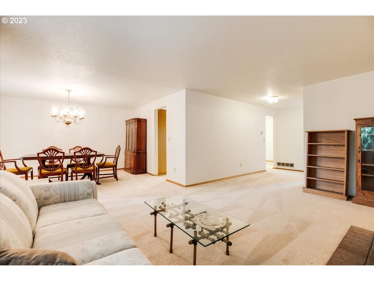 1502 Southeast Elliott Avenue Gresham, OR 97080 - Photo 8 of 37 a living room with furniture and dresser with wooden floor