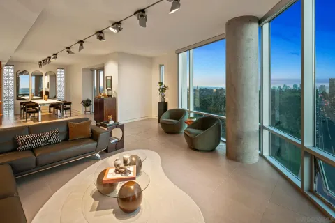 a kitchen with a sink and chairs