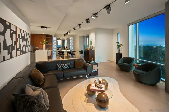 a living room with furniture and a large window