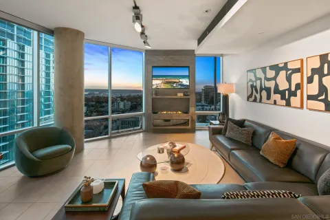 a view of a livingroom with furniture window and wooden floor