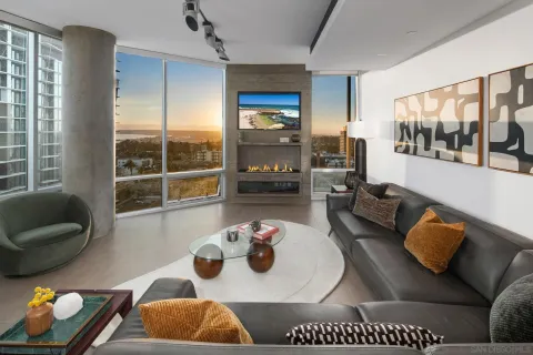 a bedroom with a bed and a potted plant