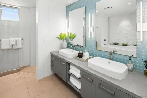 a bedroom with a large bed and a couch