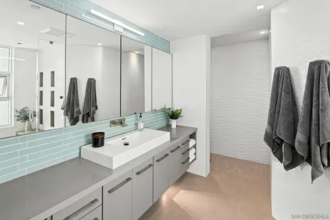 a bathroom with a sink and a mirror