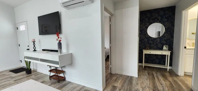 a room with table and mirror