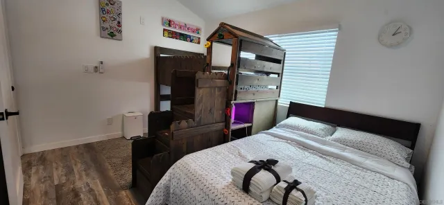 a bedroom with a bed and a closet