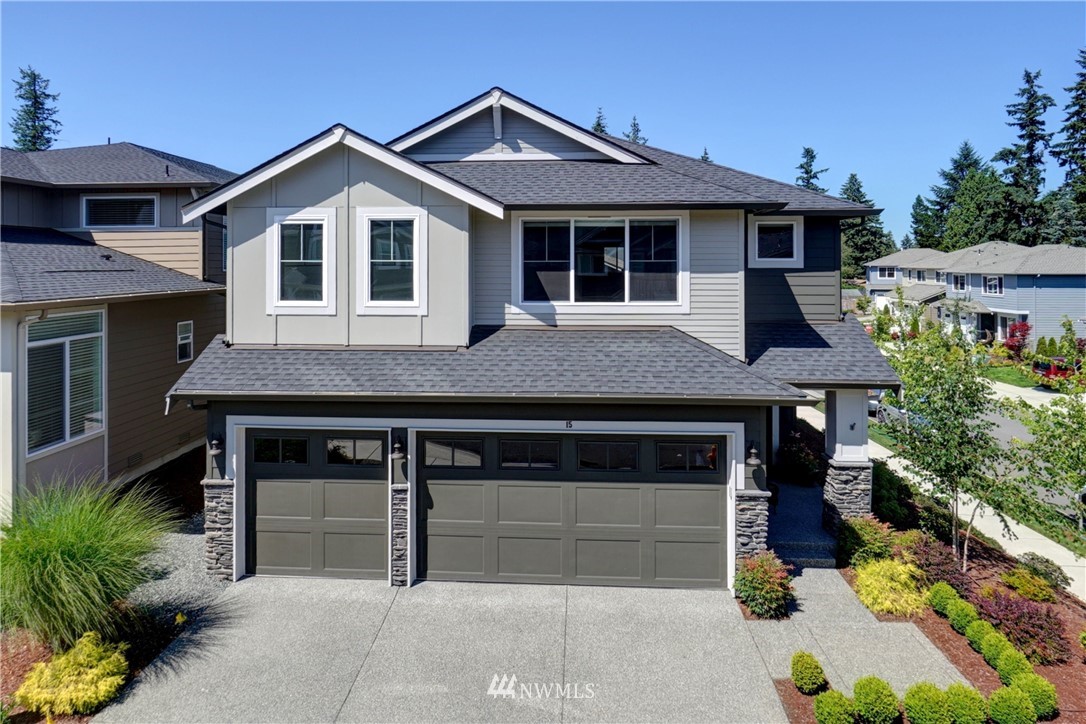 15 175th Place Southwest Bothell, WA 98012 - Photo 1 of 40 a front view of a house with a garden