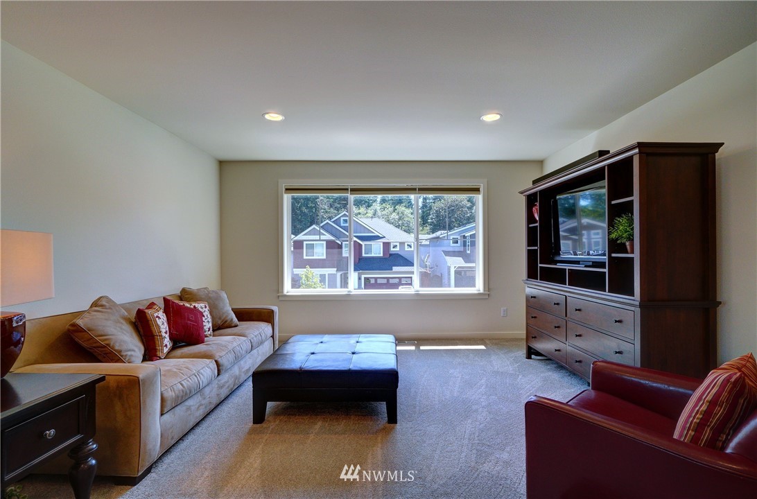 15 175th Place Southwest Bothell, WA 98012 - Photo 22 of 40 a living room with furniture and a flat screen tv