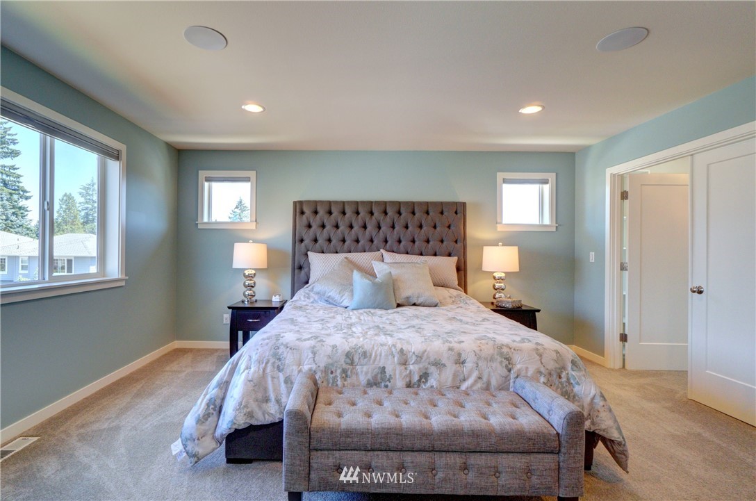 15 175th Place Southwest Bothell, WA 98012 - Photo 29 of 40 a bedroom with a bed and wooden floor