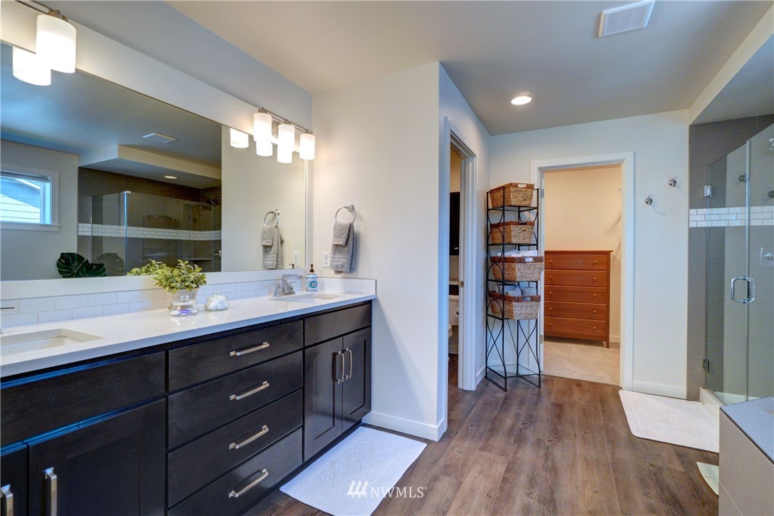15 175th Place Southwest Bothell, WA 98012 - Photo 31 of 40 a bathroom with a double vanity sink and a mirror