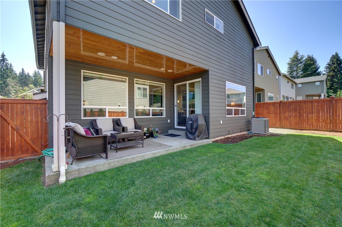 15 175th Place Southwest Bothell, WA 98012 - Photo 36 of 40 a view of a house with backyard sitting area and garden