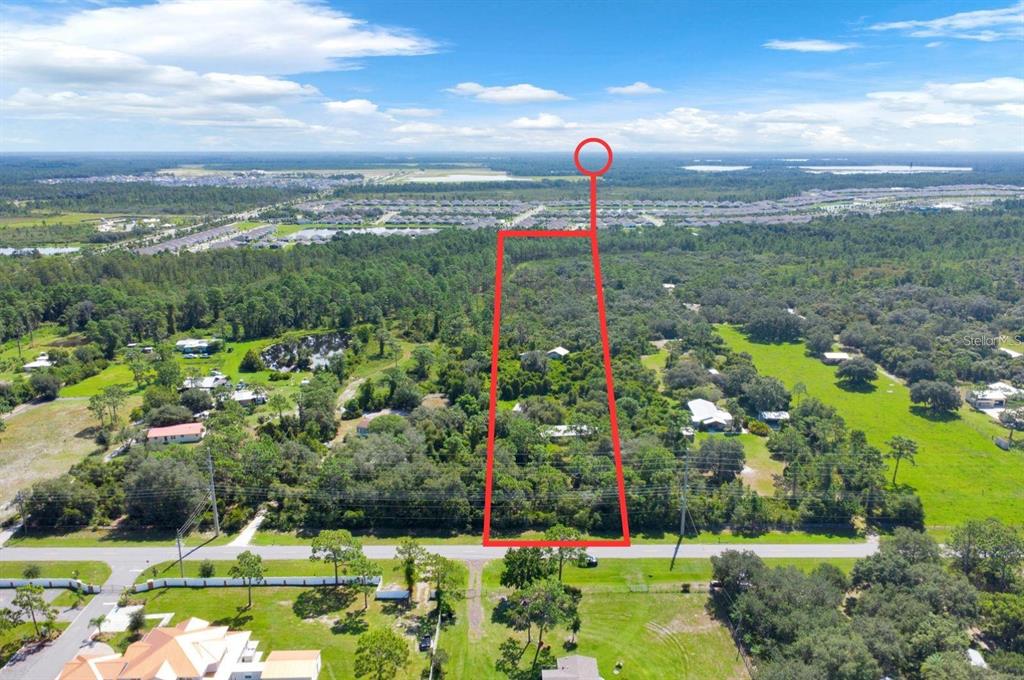 2795 Absher Road St. Cloud, FL 34771 - Photo 4 of 12 a view of a swimming pool with a yard