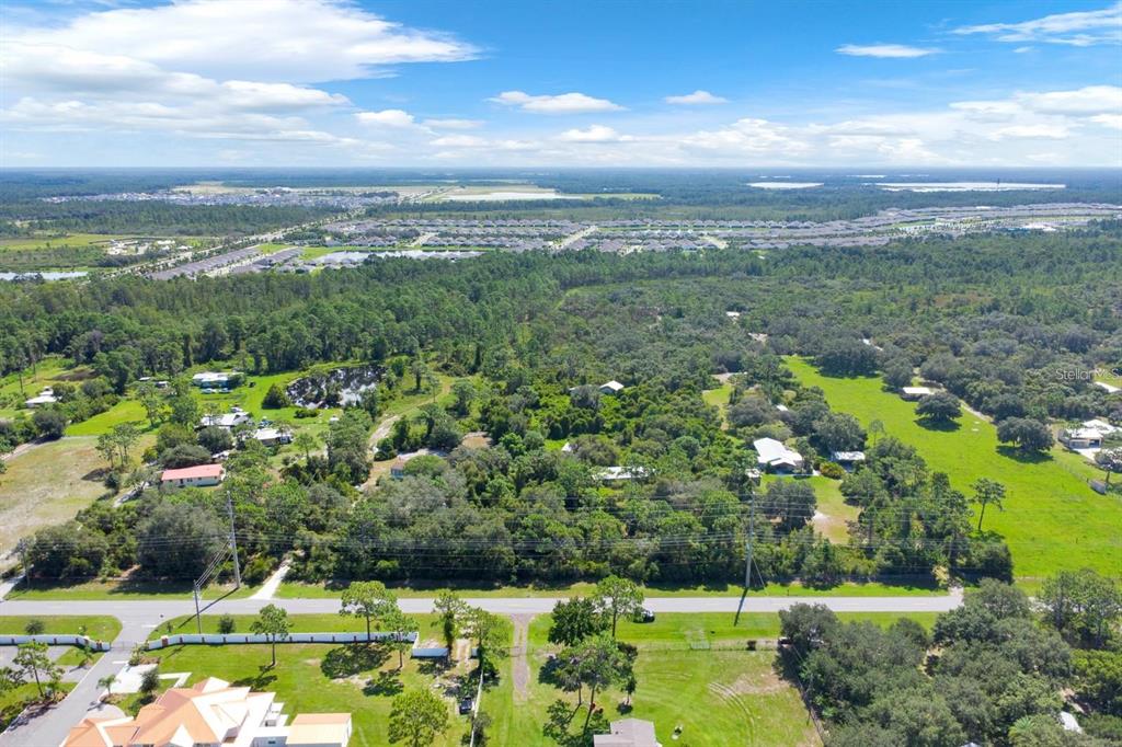 2795 Absher Road St. Cloud, FL 34771 - Photo 5 of 12 a view of a city with lush green forest