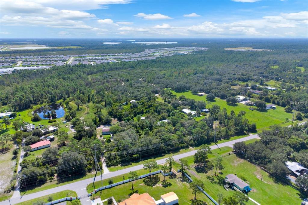 2795 Absher Road St. Cloud, FL 34771 - Photo 6 of 12 a view of a city with lush green forest