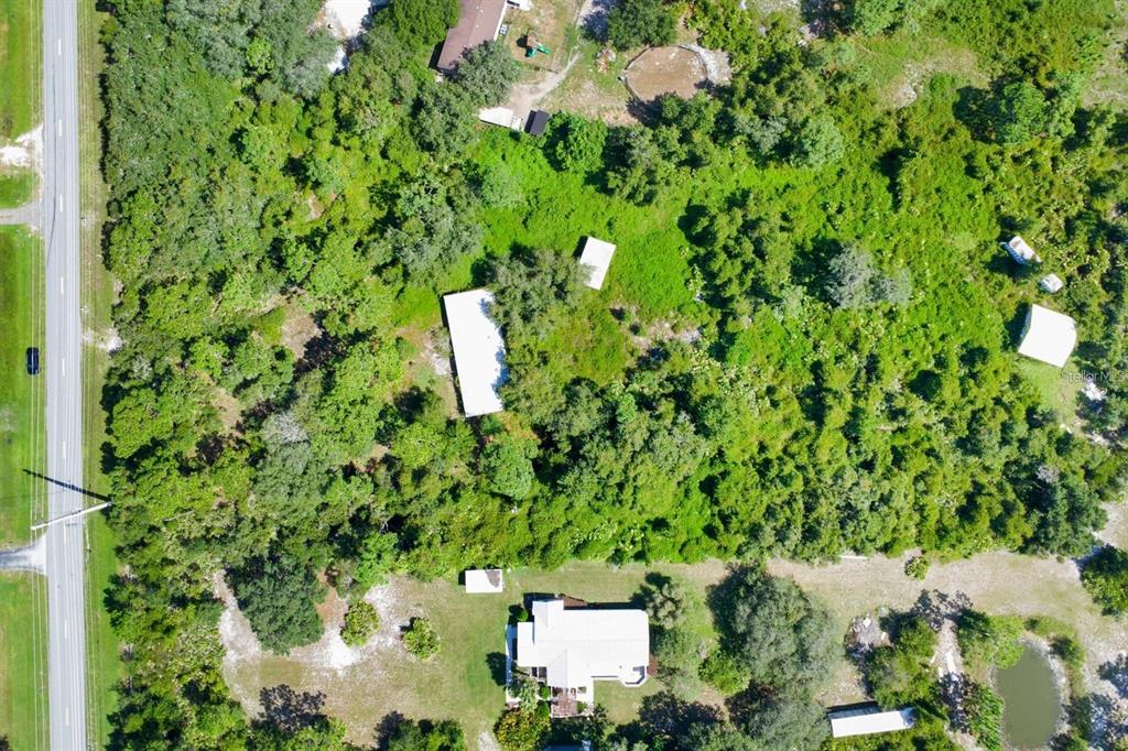2795 Absher Road St. Cloud, FL 34771 - Photo 10 of 12 an aerial view of a house with a yard