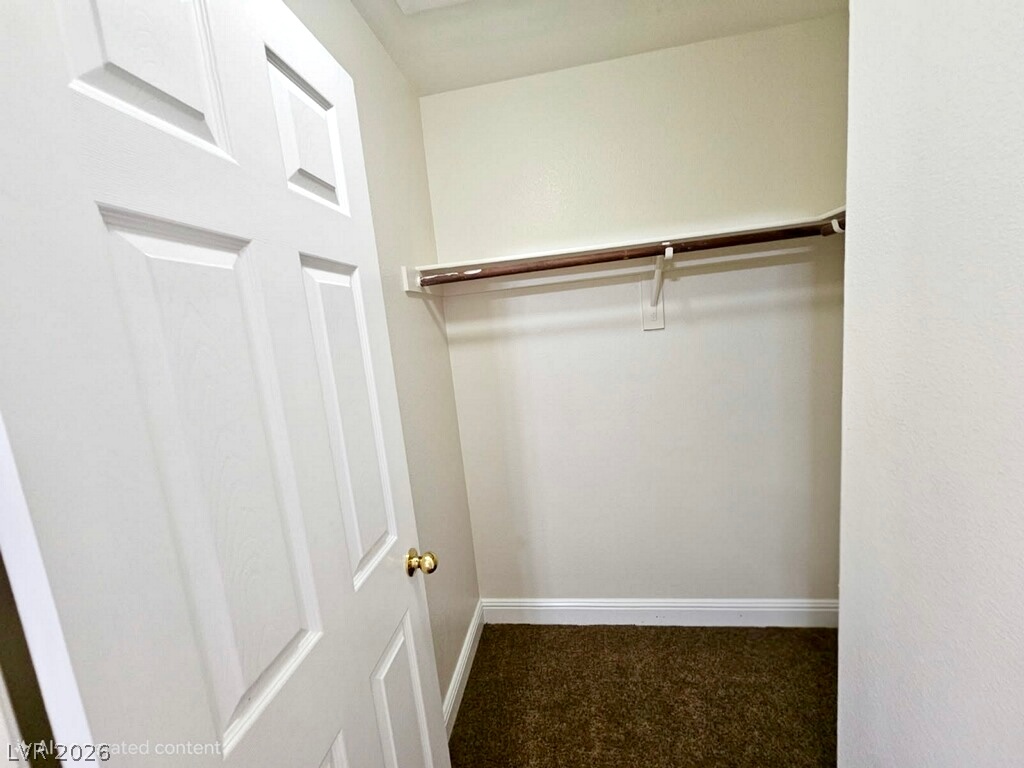 5953 Crumbling Ridge Street Henderson, NV 89011 - Photo 30 of 42 A well-appointed closet offers essential storage solutions with built-in hanging space.