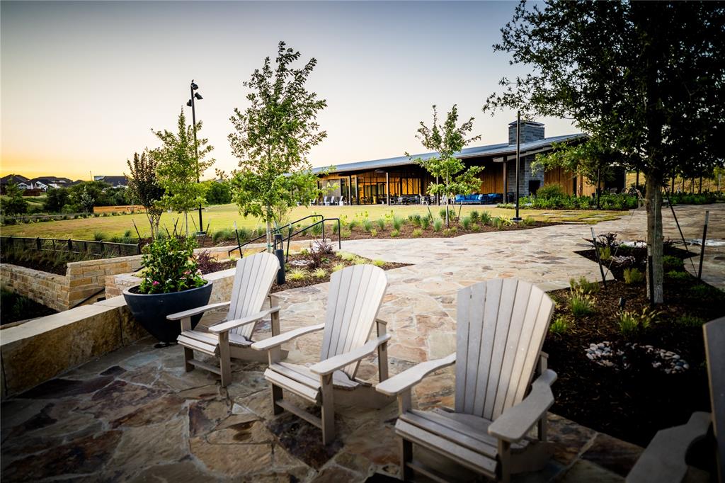 179 Summer Rain Way Rhome, TX 76078 - Photo 19 of 26 a view of a patio with couches chairs and potted plants