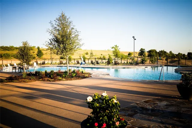a kitchen with a table chairs stove and cabinets