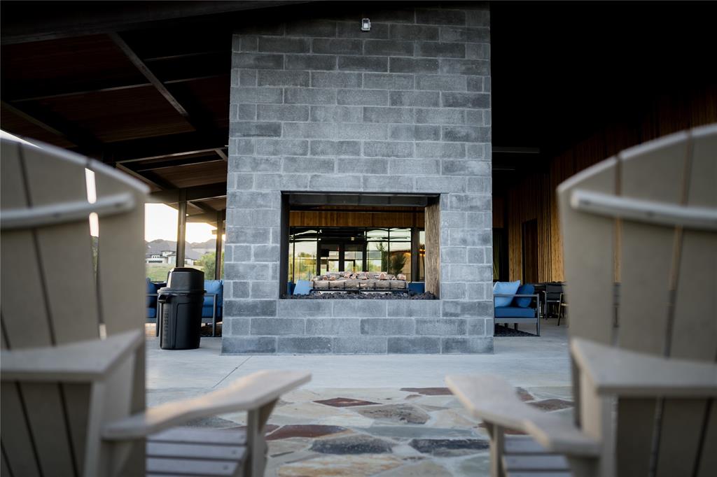 179 Summer Rain Way Rhome, TX 76078 - Photo 8 of 26 a living room with furniture and a fireplace