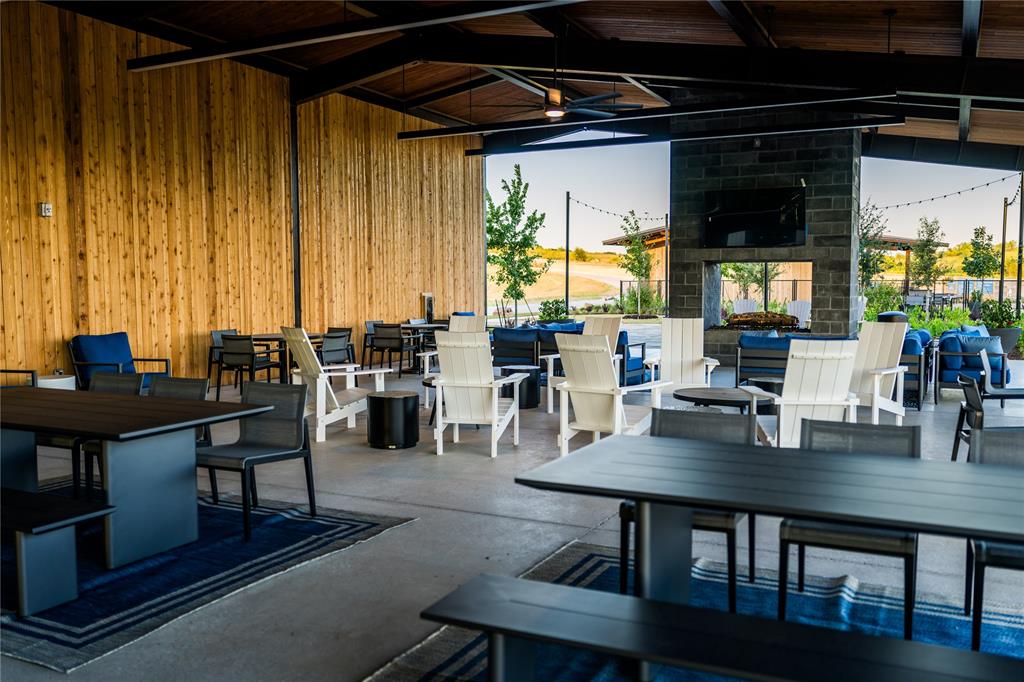 179 Summer Rain Way Rhome, TX 76078 - Photo 9 of 26 a dining room with furniture and wooden floor