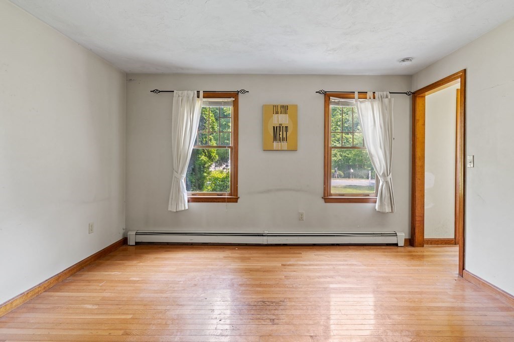 44 Smith Road Mansfield, MA 02048 - Photo 15 of 21 an empty room with wooden floor and windows