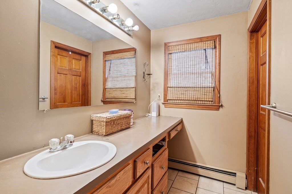 44 Smith Road Mansfield, MA 02048 - Photo 17 of 21 a bathroom with a sink and a mirror