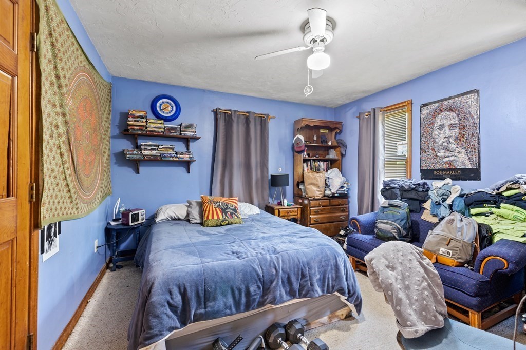 44 Smith Road Mansfield, MA 02048 - Photo 20 of 21 a bedroom with furniture and a chandelier