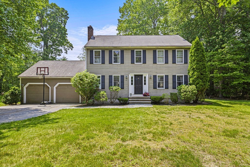 44 Smith Road Mansfield, MA 02048 - Photo 2 of 21 a front view of a house with a yard