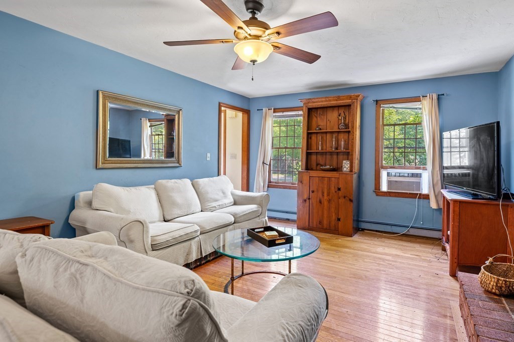 44 Smith Road Mansfield, MA 02048 - Photo 3 of 21 a living room with furniture a ceiling fan and a window