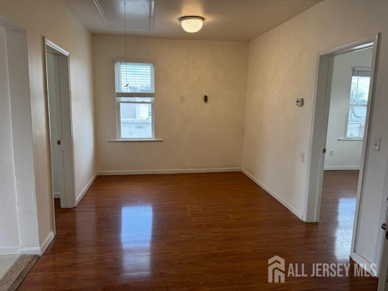 721 Lincoln Boulevard Middlesex, NJ 08846 - Photo 8 of 11 an empty room with wooden floor and windows