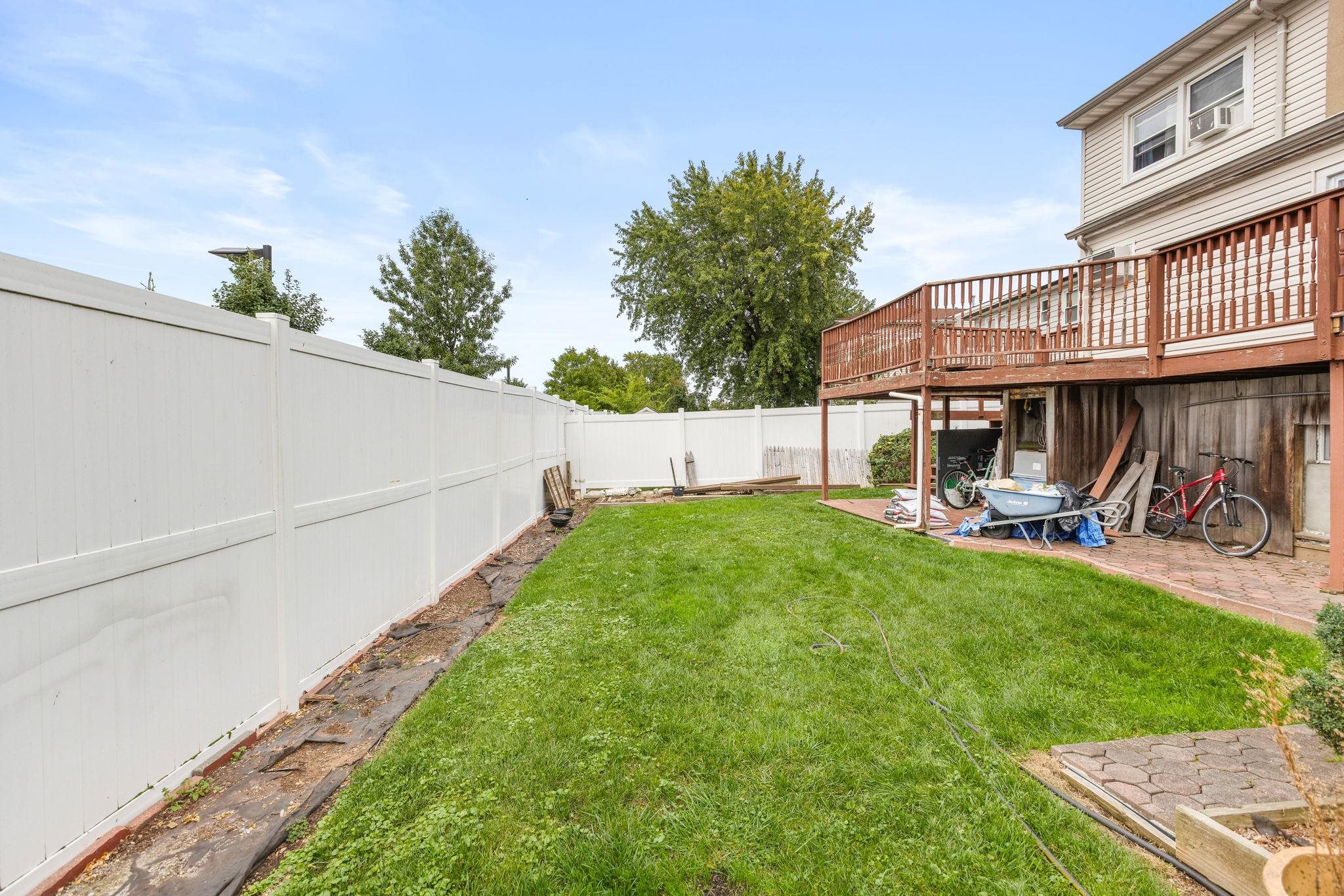 665 9th Street, Unit A Secaucus, NJ 07094 - Photo 16 of 17 a view of a house with backyard and sitting area