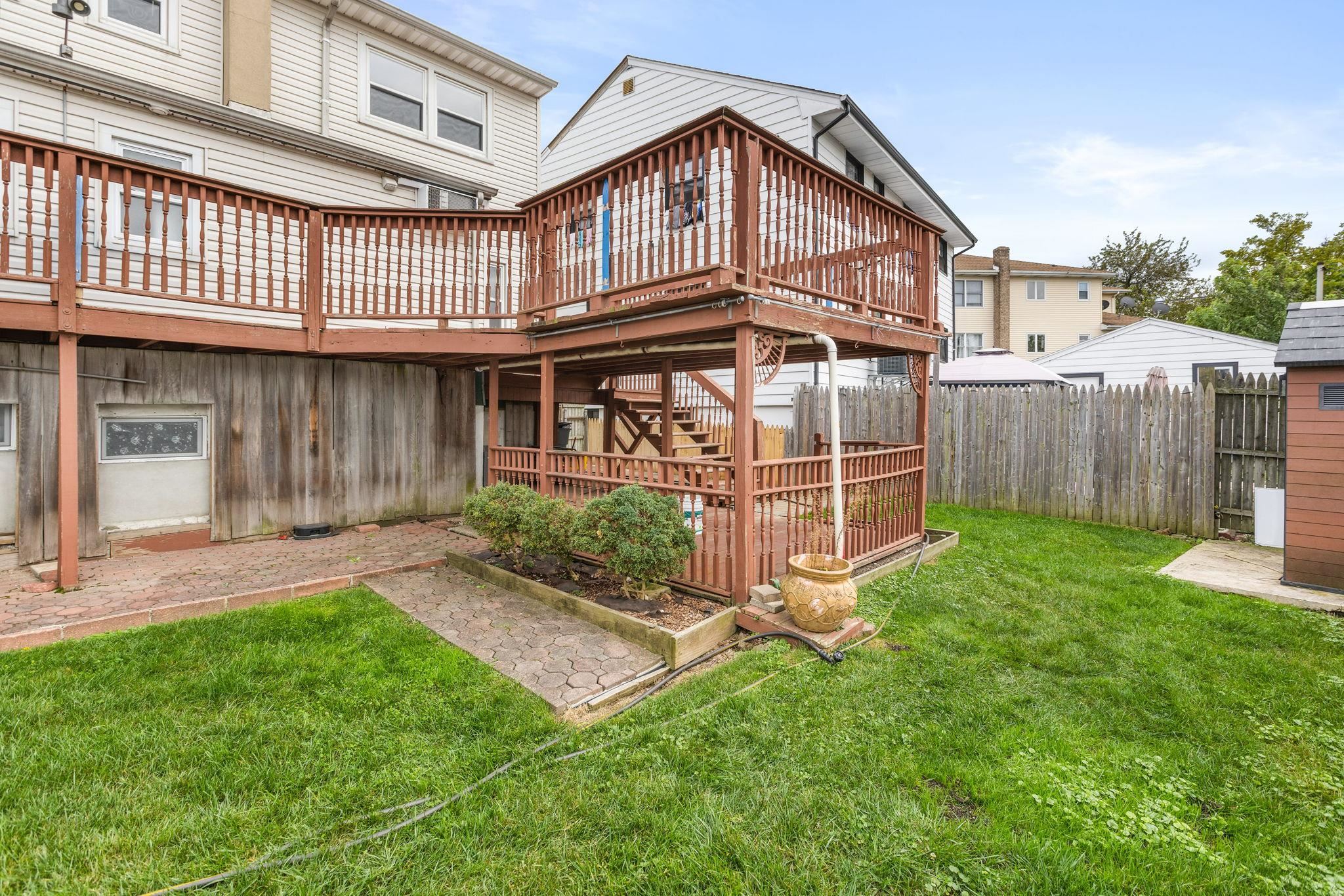 665 9th Street, Unit A Secaucus, NJ 07094 - Photo 17 of 17 a view of a house with a yard and sitting area