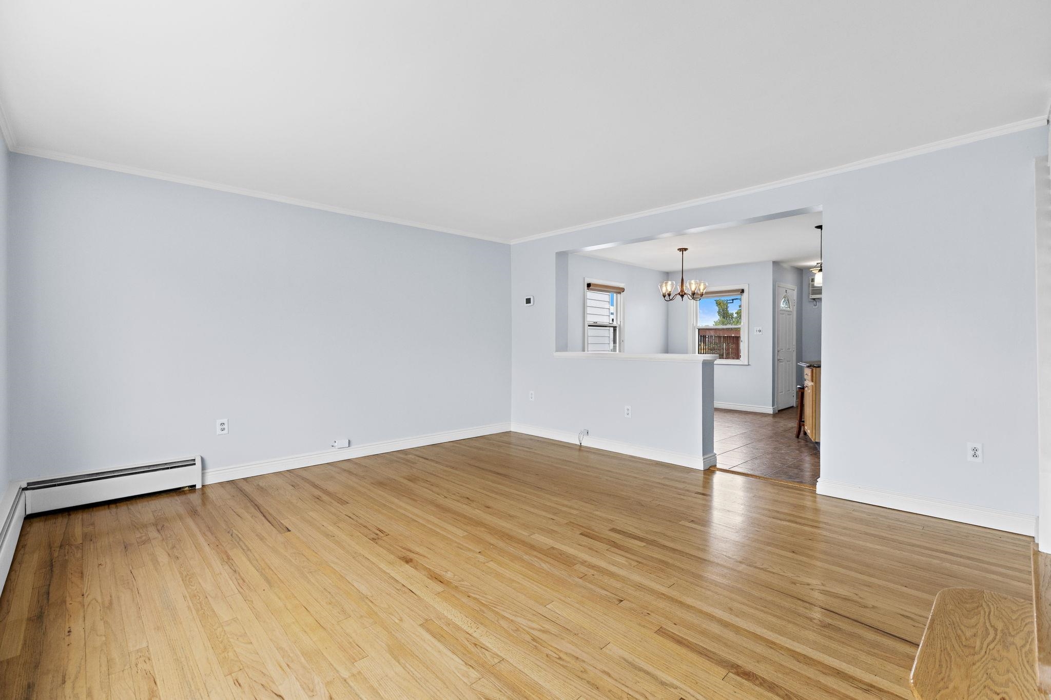 665 9th Street, Unit A Secaucus, NJ 07094 - Photo 4 of 17 a view of empty room with wooden floor