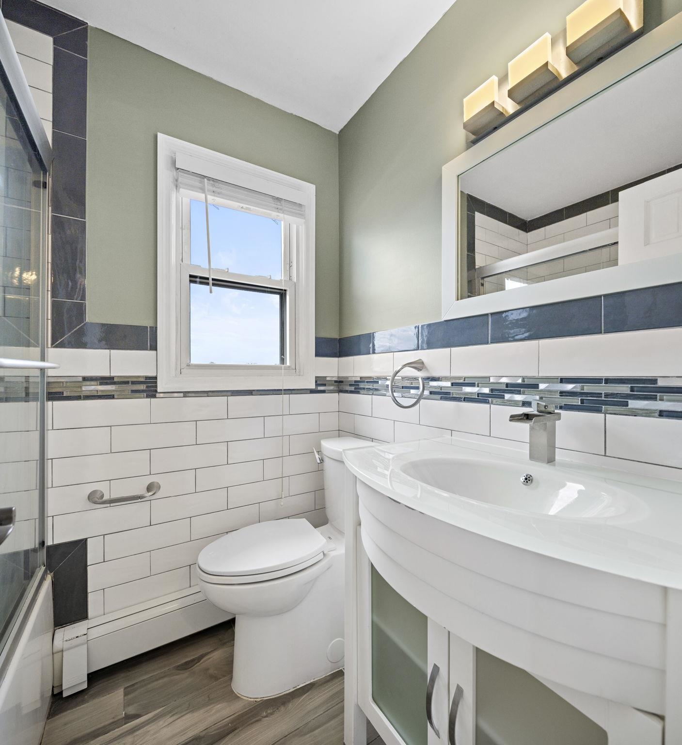 665 9th Street, Unit A Secaucus, NJ 07094 - Photo 5 of 17 a bathroom with a sink and a toilet