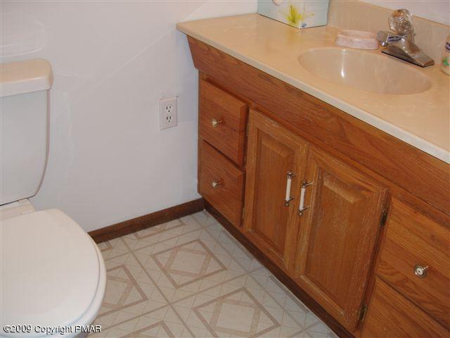 153 Little Twig Road Effort, PA 18330 - Photo 11 of 22 a bathroom with a sink and a mirror
