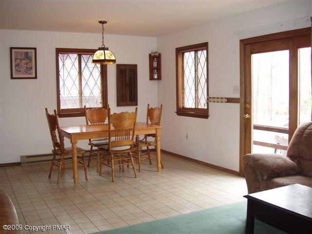 153 Little Twig Road Effort, PA 18330 - Photo 8 of 22 a view of a dining room with furniture window and wooden floor