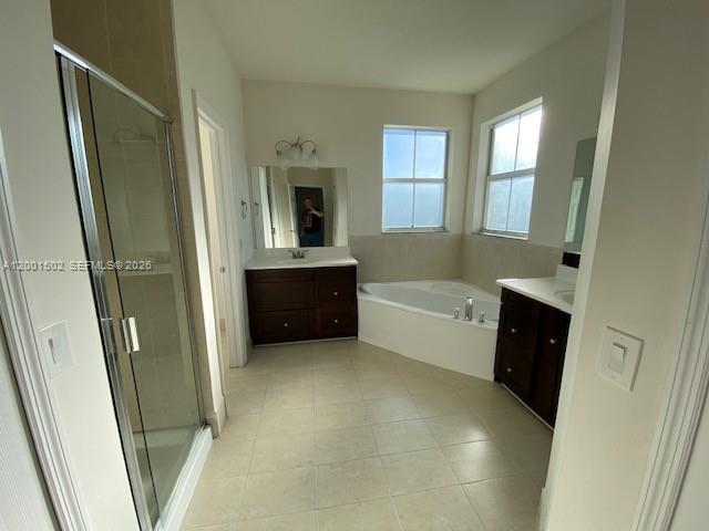 16568 Southwest 54th Street Miami, FL 33185 - Photo 11 of 30 a bathroom with a tub sink and mirror