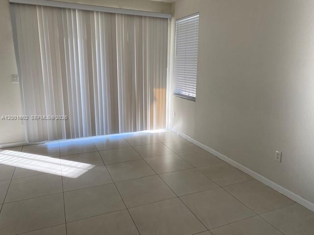 16568 Southwest 54th Street Miami, FL 33185 - Photo 20 of 30 a view of a livingroom with an empty space and a window