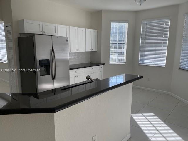 16568 Southwest 54th Street Miami, FL 33185 - Photo 3 of 30 a kitchen with granite countertop a refrigerator and a sink