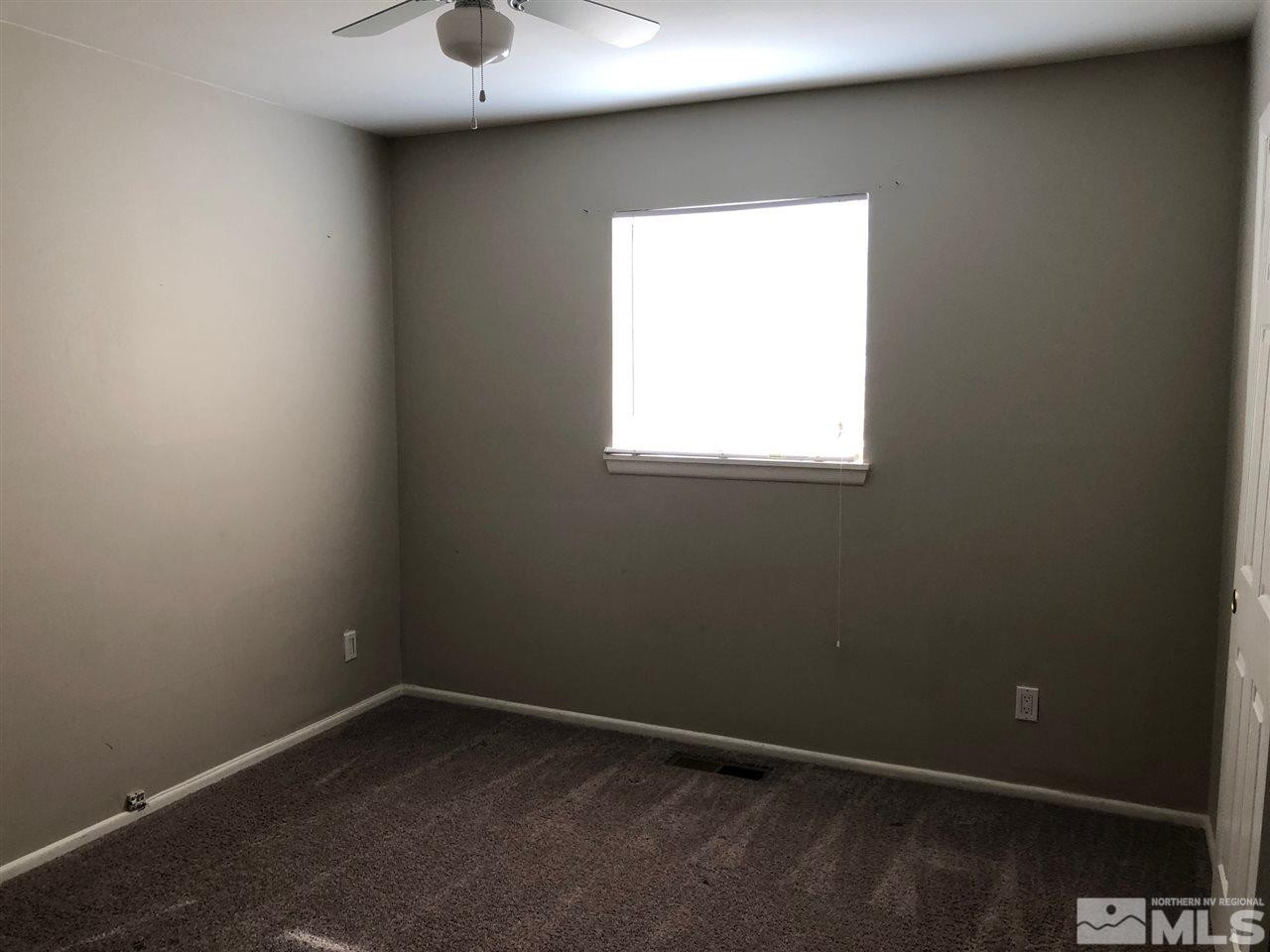 1230 Wilkinson Avenue Reno, NV 89502 - Photo 8 of 12 an empty room with a window