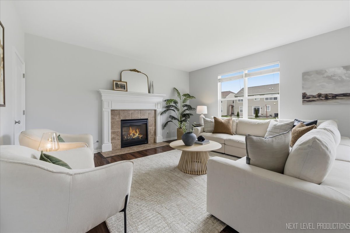 5734 Oak Ridge Way Lisle, IL 60532 - Photo 12 of 33 a living room with furniture and a fireplace