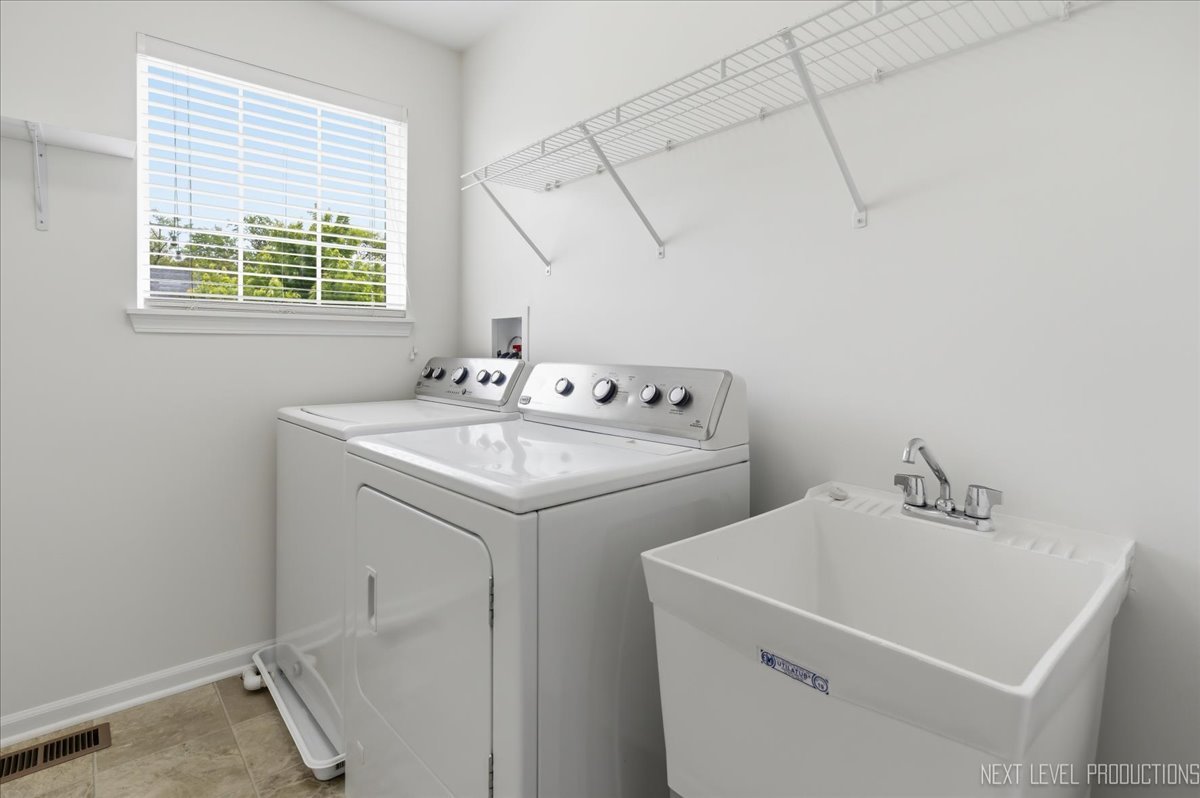 5734 Oak Ridge Way Lisle, IL 60532 - Photo 26 of 33 a utility room with dryer and washer