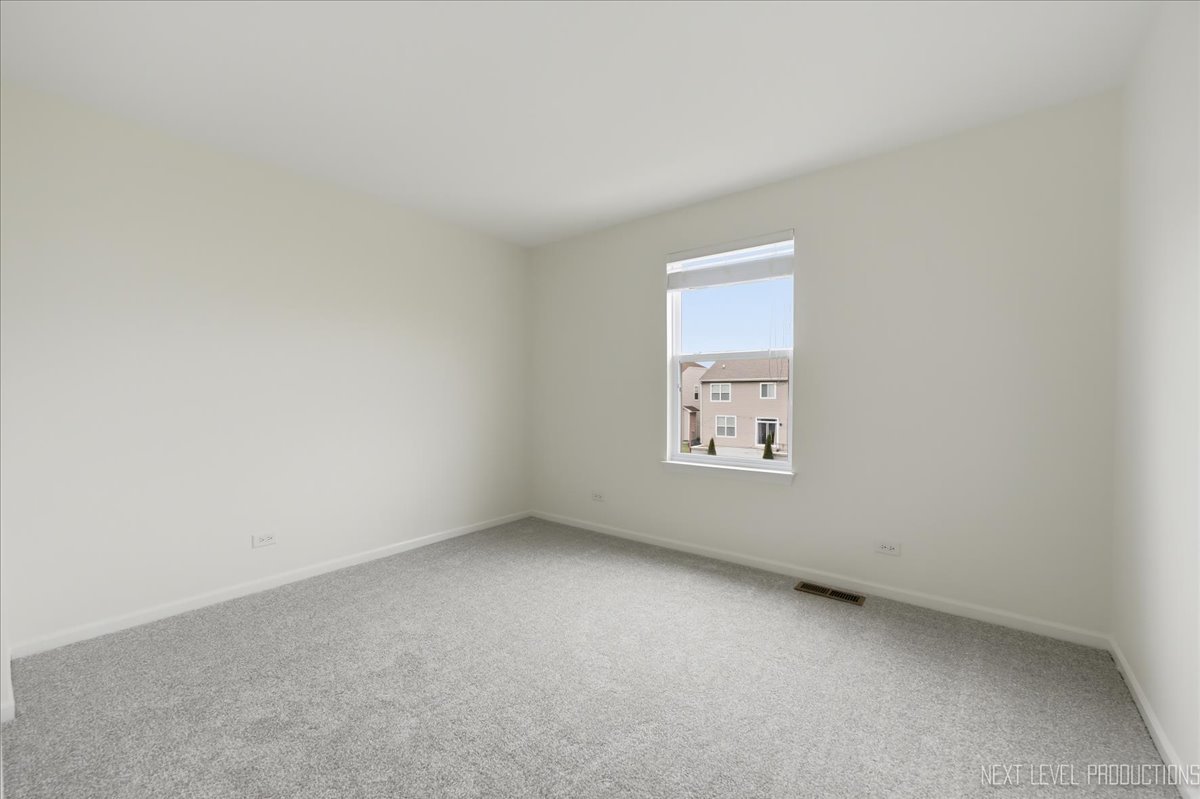 5734 Oak Ridge Way Lisle, IL 60532 - Photo 30 of 33 an empty room with a window
