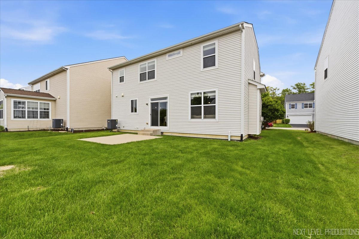5734 Oak Ridge Way Lisle, IL 60532 - Photo 32 of 33 a view of a house with a backyard