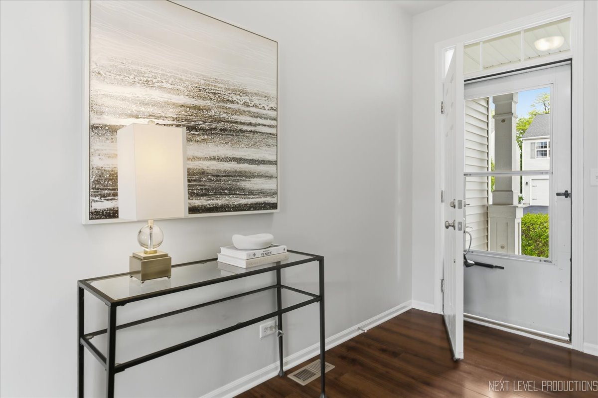 5734 Oak Ridge Way Lisle, IL 60532 - Photo 4 of 33 a room with a window and wooden floor