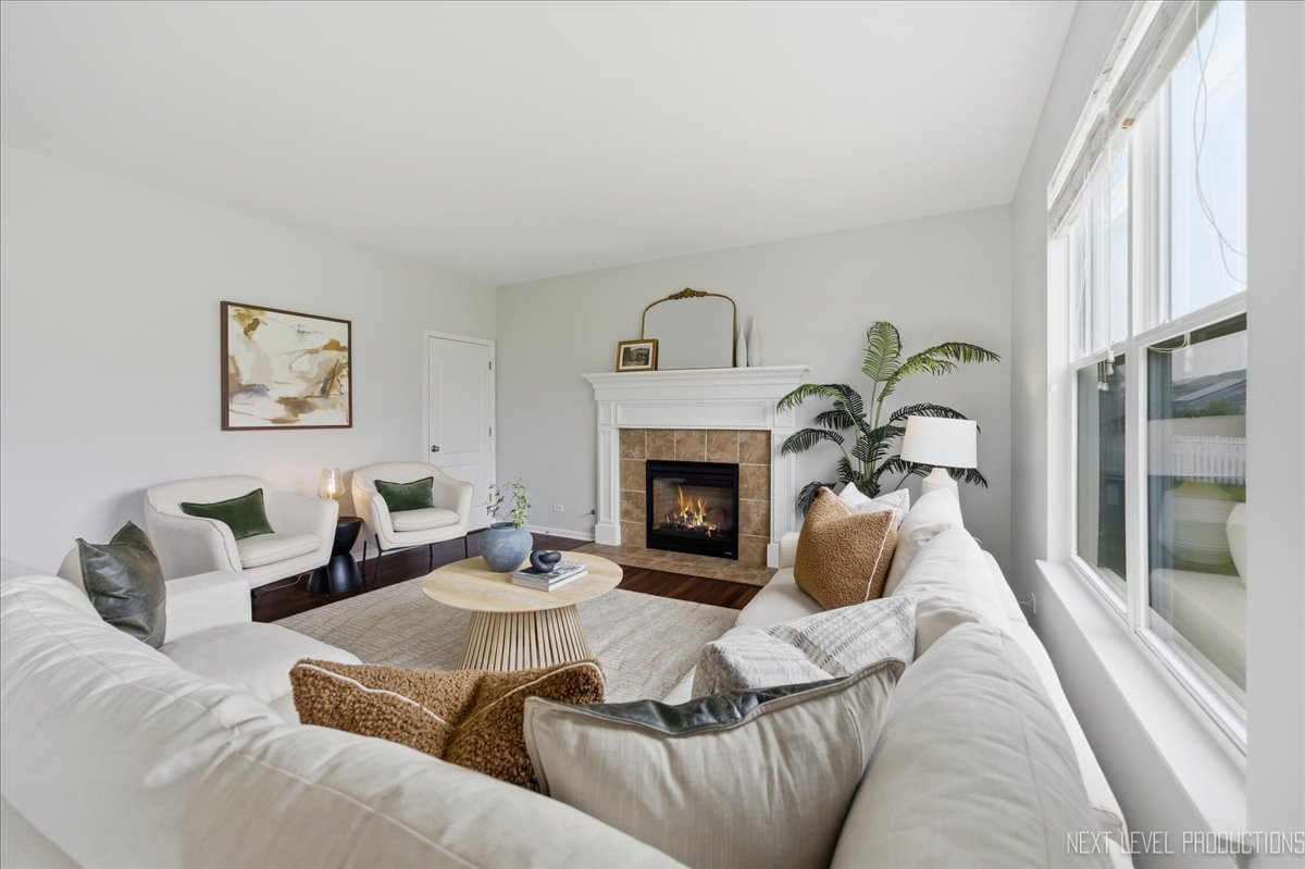 5734 Oak Ridge Way Lisle, IL 60532 - Photo 10 of 33 a living room with furniture and a fireplace