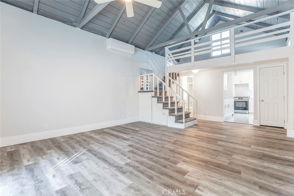 7020 Greeley Street Tujunga, CA 91042 - Photo 4 of 18 a view of an empty room with wooden floor