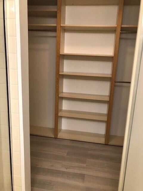 2811 Village Boulevard, Unit 202 West Palm Beach, FL 33409 - Photo 7 of 10 a view of walk in closet with empty racks